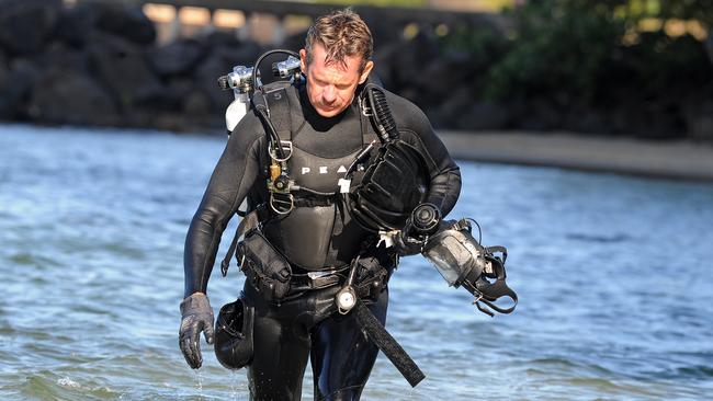 Police divers looking for evidence at Jack Evans boat harbour. Picture: AAP