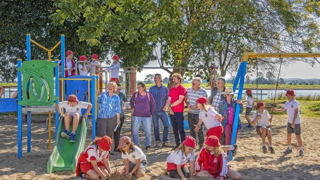 NOT FORGOTTEN: Members of Ulmarra Village Inc and students from Ulmarra Public School gather at Bailey Park as Clarence Valley Council plans for the riverfront redevelopment. Picture: Adam Hourigan