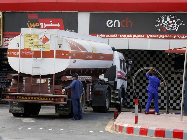 Workers refuel the tank at a petrol station in Jiddah, Saudi Arabia. Saturday’s attacks halved oil output in Saudi Arabia, the world’s top crude exporter. Picture: AP