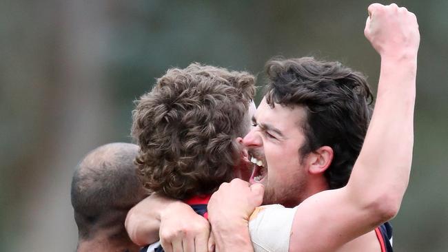 Swifts Creek players celebrate last season’s premiership. Picture Yuri Kouzmin