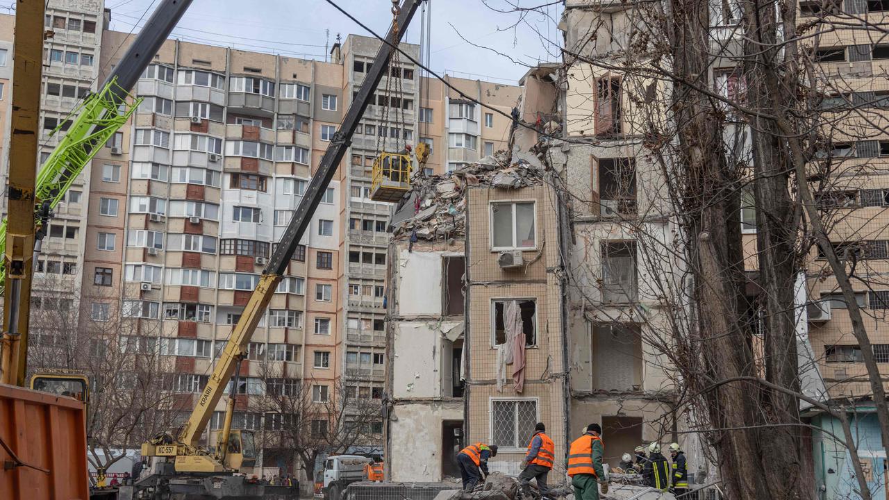 Rescuers clear debris in a multistorey building heavily damaged following a drone strike, in Odessa. Picture: AFP