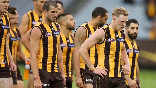 James Sicily trudges off with his Hawthorn teammates after their loss to Western Bulldogs. Picture: Michael Klein.