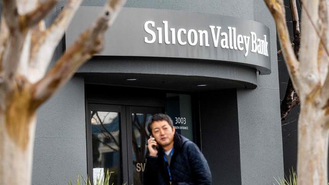 A pedestrian speaks on a mobile telephone as he walks past Silicon Valley Bank’s headquarters in Santa Clara, California on March 10, 2023. Picture: NOAH BERGER / AFP)