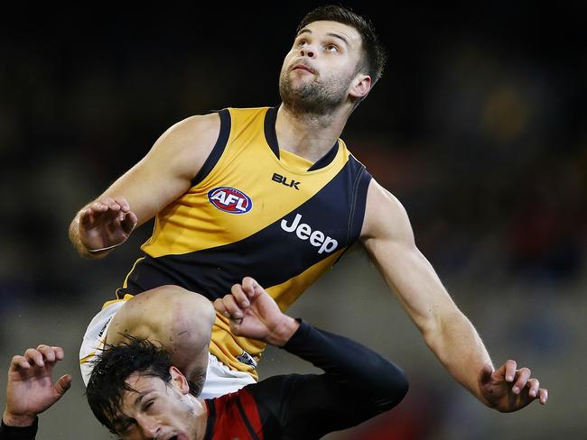 Essendon v Richmond Ben Lennon flies over Mark Baguely Picture:Wayne Ludbey