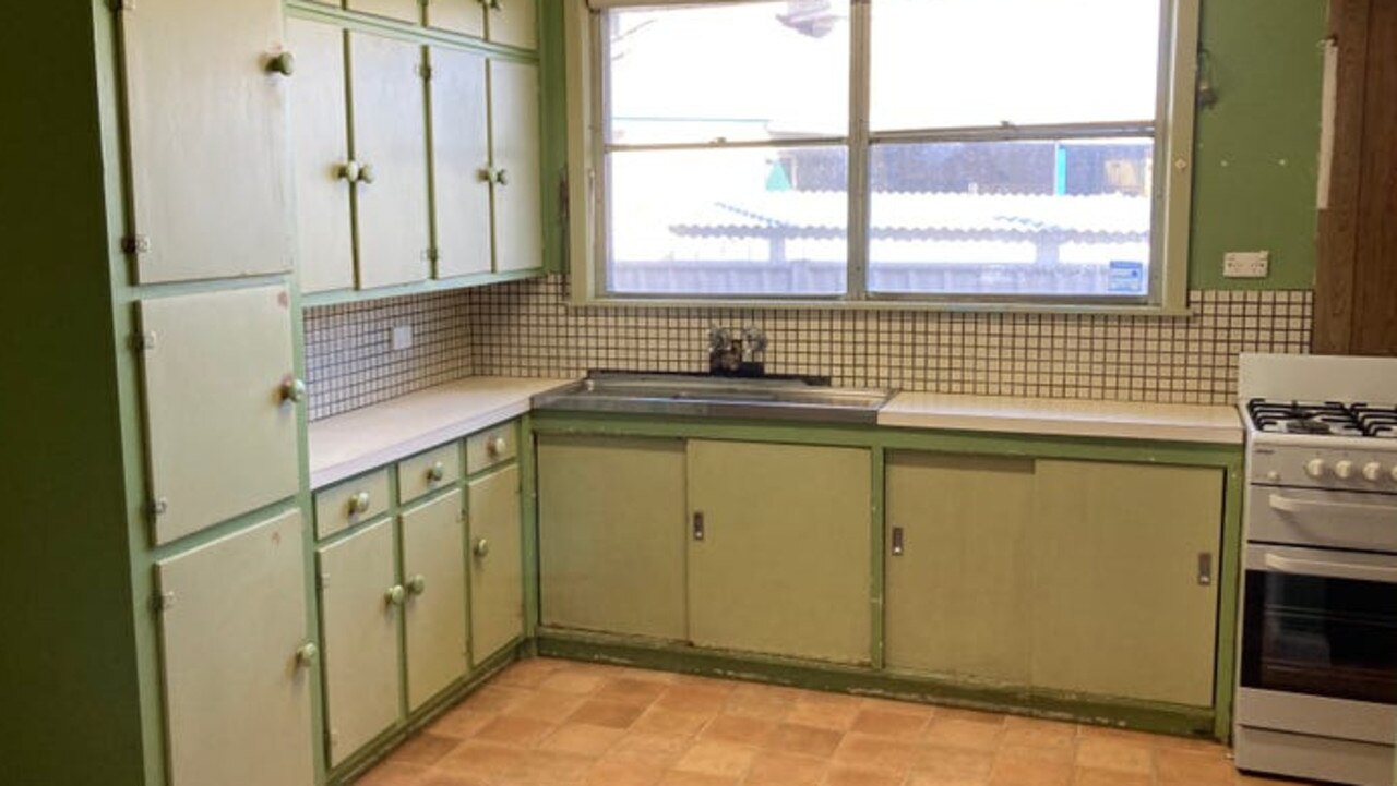 Cabinetry in the kitchen in poor condition.