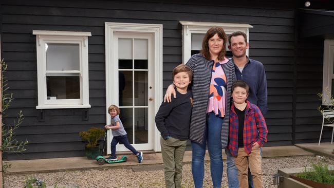 Kate and Rob Cooper with children Ned, George and Humphrey (on scooter) at their Red Hill Airbnb property. Picture: Stefan Postles