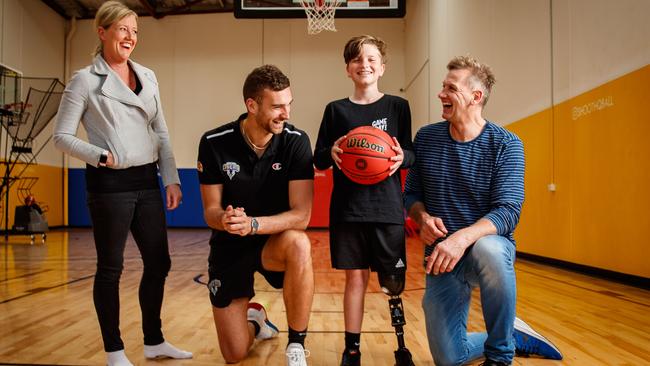 Cooper Spillane with 36ers Jack McVeigh and Mix 102.3’s Jodie Oddie and Mark “Soda” Soderstrom. Picture: Matt Turner