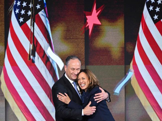 US Vice President and Democratic presidential candidate Kamala Harris hugs Second Gentleman Douglas Emhoff after speaking today. Picture: Mandel Ngan / AFP