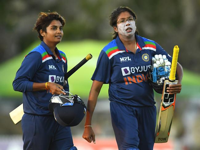 Meghna Singh and Jhulan Goswami of India walk off the field after their victory during game three of the Women's One Day International series between Australia and India at Great Barrier Reef Arena on September 26, 2021 in Mackay, Australia. Picture: Albert Perez