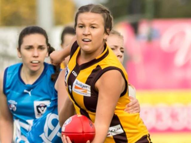 Olivia Flanagan dishes off a handball during the VFL Women's season for Box Hill Hawks. Picture: Kadek Thatcher Photography