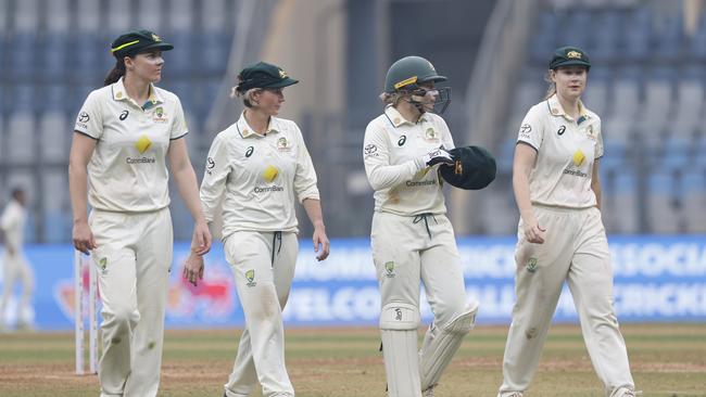 Australian skipper Alyssa Healy (second from right) leads her side off the field after a brutal Day 2 against India in the sole Test of their tour at Mumbai. Picture: Pankaj Nangia/Getty Images