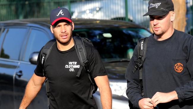 Corey Norman (left) arrives at Pirtek Stadium for training.