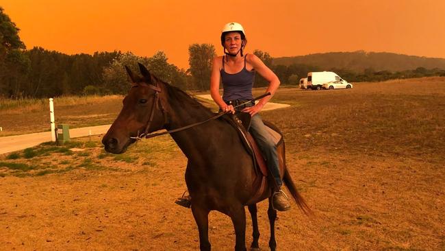 Bec Winter on her fire-razed property, which has been targeted by looters. Picture: Cath Blyth