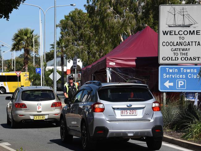 Police check cars at the Queensland border with NSW in Coolangatta. Picture: NCA NewsWire / Steve Holland