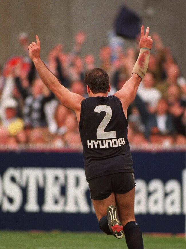 Greg Williams wheels away in celebration after one of his five goals in the 1995 Grand Final.