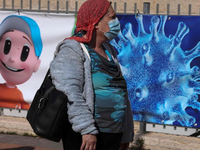 A woman waits to receive a dose of the Pfizer-BioNtech COVID-19 vaccine in Jerusalem. Picture: AFP.