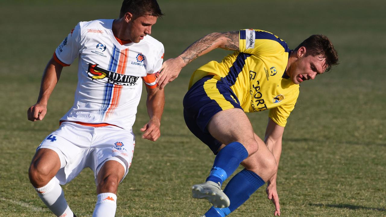 United's Brandon Reeves tries to evade Matija Simic. Picture: Steve Holland