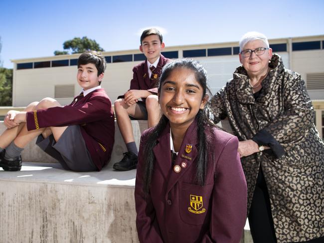 Dominic students Yiannis Nikitaris, 12, Lucas Atkinson, 12, and Anit Saju, 14, with principal Beth Gilligan. Dominic College spent $6.2 million on capital spending over three years. Picture: RICHARD JUPE