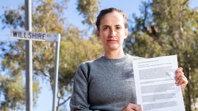 Suki Dorras-Walker with a letter she has written to the Alice Springs Town Council requesting that the name of Willshire Street be changed. Picture: Emma Murray