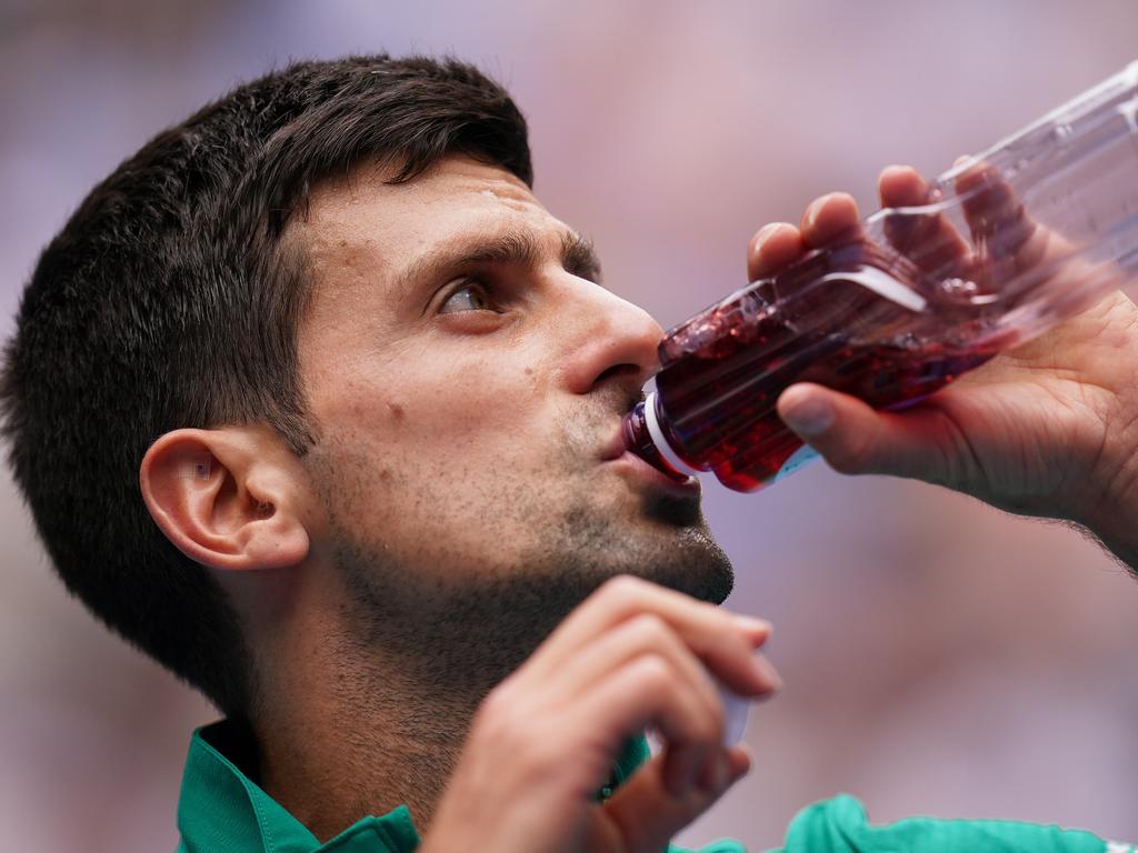 Novak Djokovic takes a swig from a sports drink during the 2020 Australian Open. Picture: Dave Hunt/AAP