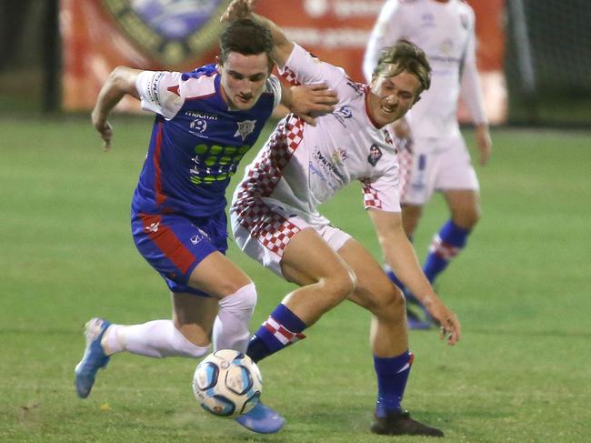 Gold Coast Knights midfielder Max Brown (right) battles Peninsula Power’s Joshua Woolley in tonight’s NPL semi final at Carrara. Picture: Mike Batterham