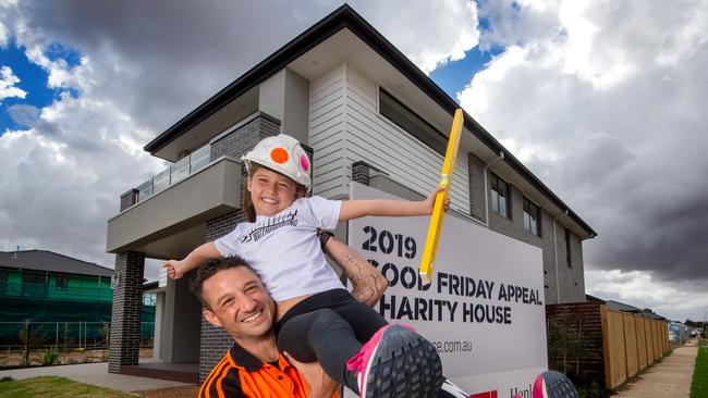 Adrian Murgana with his daughter Aleesha outside the home. Picture: Jay Town