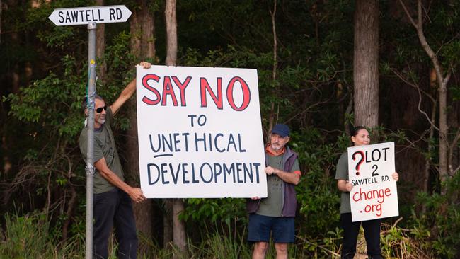 Community members pictured protesting against the Sawtell Rd DA in 2018.