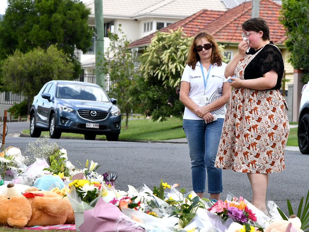 People drop off flowers at the scene where Hannah Clarke and her children were killed by their father Rowan Baxter. Picture: AAP/John Gass