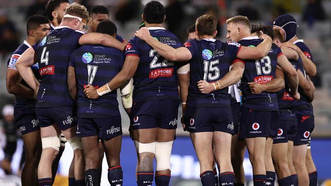 CANBERRA, AUSTRALIA - JULY 04: Rebels players huddle after a try during the round one Super Rugby AU match between the Brumbies and the Rebels at GIO Stadium on July 04, 2020 in Canberra, Australia. (Photo by Cameron Spencer/Getty Images)