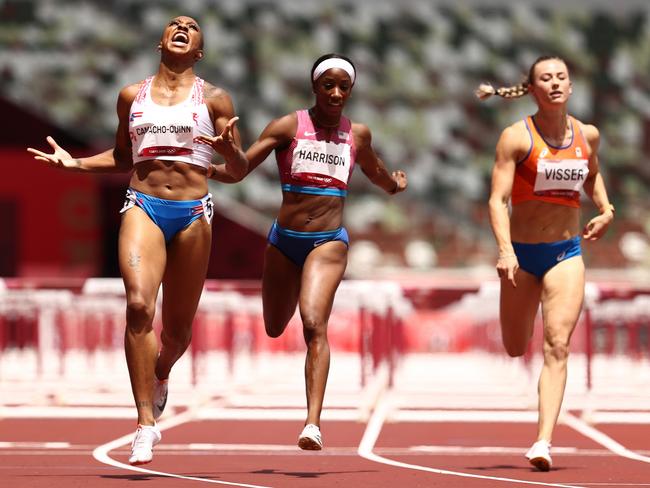 Jasmine Camacho-Quinn celebrates as she finishes first ahead of Kendra Harrison in the women's 100m hurdles final. Picture: Getty Images