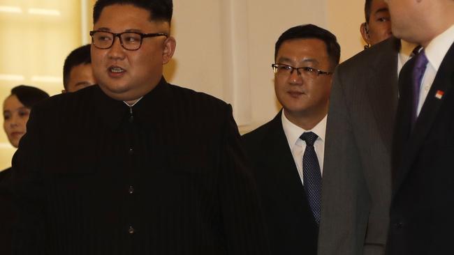 Kim Jong-un's sister Kim Yo jong, left, is seen in the background as Mr Kim arrives to meet with Singapore's Prime Minister Lee Hsien Loong. Picture: AP.