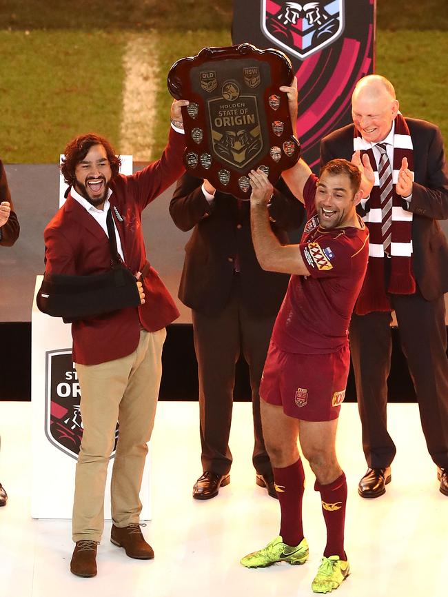 Johnathan Thurston and Cameron Smith of the Maroons lift the trophy after game three of the State Of Origin series. Photo: Getty Images