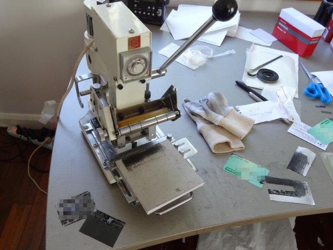 A card forging machine seized by NSW Police in an operation targeting identity theft operations. Picture: Supplied