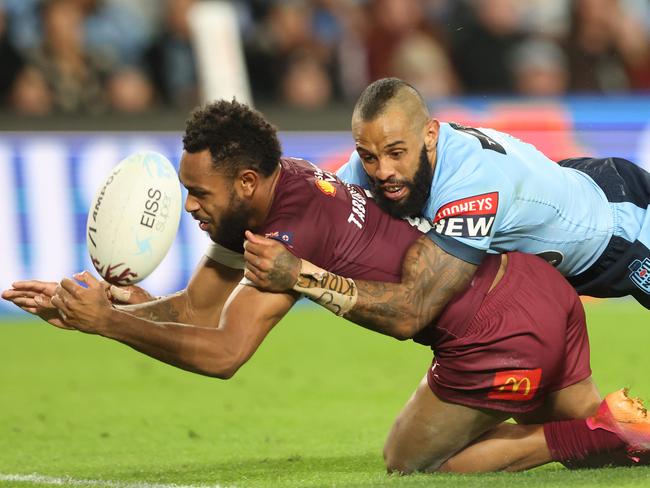 Maroons’ Hamiso Tabuai-Fidow is tackled in goal by Blues’ Josh Addo-Carr. One of the few times the pair of speedsters came together in Origin. Pic Peter Wallis