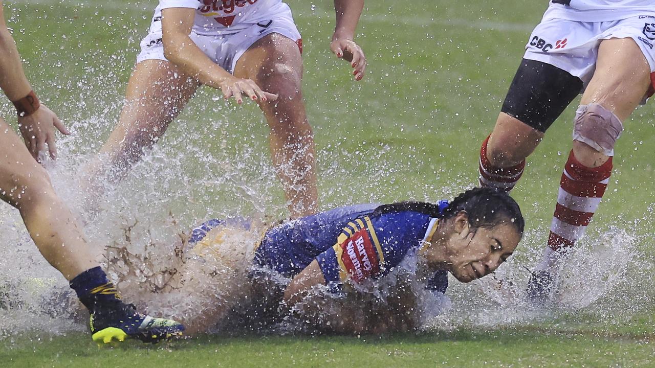 Tiana Penitani of the Eels is tackled in pouring rain during the round two NRLW match between the St George Illawarra Dragons and the Parramatta Eels at WIN Stadium. Pic: Getty.