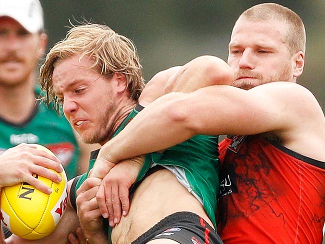 MELBOURNE, AUSTRALIA - APRIL 05:  Darcy Parish of the Bombers is tackled by Jake Stringer of the Bombers during an Essendon Bombers training session at The Hangar on April 5, 2018 in Melbourne, Australia.  (Photo by Daniel Pockett/Getty Images)