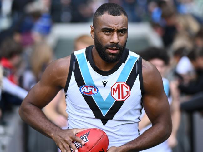 MELBOURNE, AUSTRALIA - APRIL 20:  Esava Ratugolea of the Power runs out onto the field during the round six AFL match between Collingwood Magpies and Port Adelaide Power at Melbourne Cricket Ground, on April 20, 2024, in Melbourne, Australia. (Photo by Quinn Rooney/Getty Images)