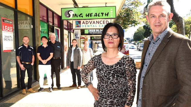 Lily Zheng and Mark Williams with some business owners in Mt Gravatt Central. (AAP image, John Gass)