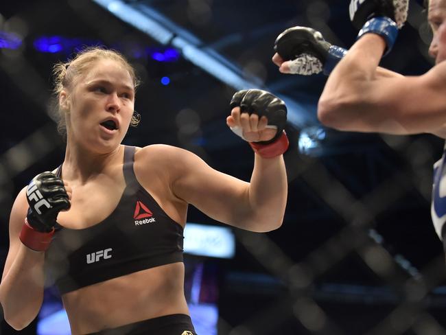 Rousey lining up compatriot Holly Holm during the UFC title fight in Melbourne in 2015. Picture: AFP PHOTO / PAUL CROCK