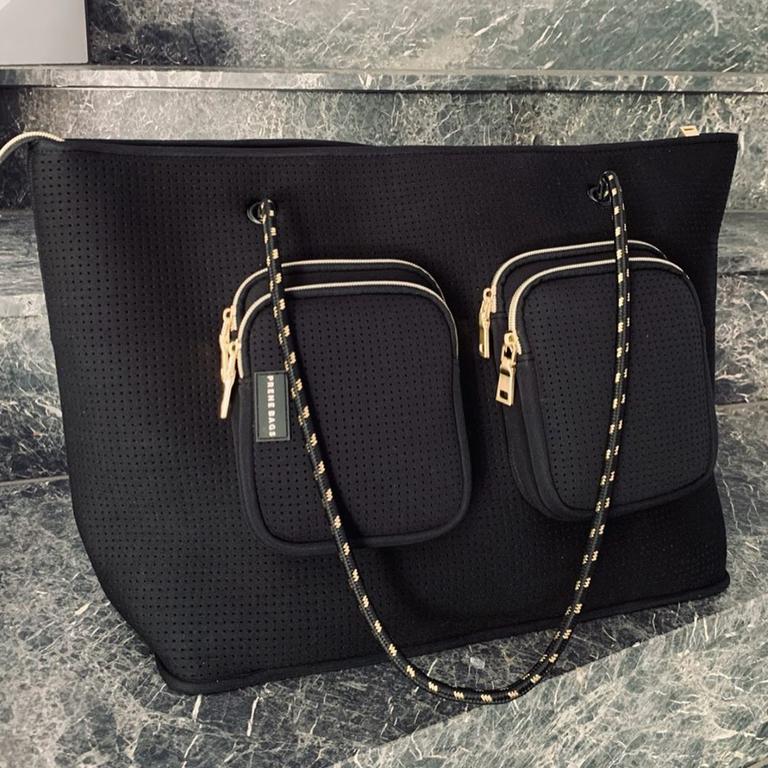 The bag, made from the same material as wetsuits, is the ‘biggest’ the brand has ever made, proving popular with mums. Picture: Instagram / Bec Judd