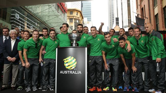 SYDNEY, AUSTRALIA - FEBRUARY 01: Socceroos players pose with the Asian Cup during celebrations at Westfield Sydney on February 1, 2015, after the Socceroos won the 2015 Asian Cup last night, in Sydney, Australia. (Photo by Mark Metcalfe/Getty Images)