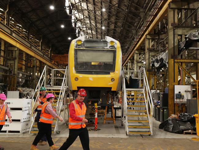 Workers inside the Downer Rail Manufacturing Facility at Maryborough. Picture Lachie Millard