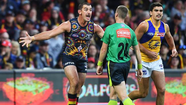 Taylor Walker remonstrates with the umpire after giving away a free kick against West Coast Eagles at Adelaide Oval on Saturday. Picture: Mark Brake/Getty Images