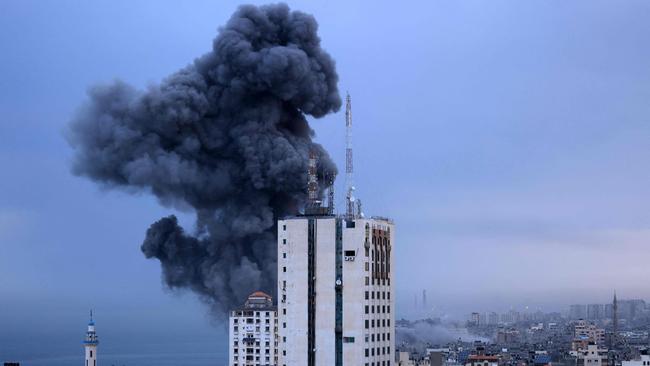 Smoke rises during an Israeli air strike on Gaza City on Sunday. Picture: AFP