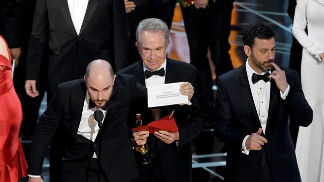 La La Land producer Jordan Horowitz holds up the winner card reading actual Best Picture winner, Moonlight, during the 89th Annual Academy Awards.