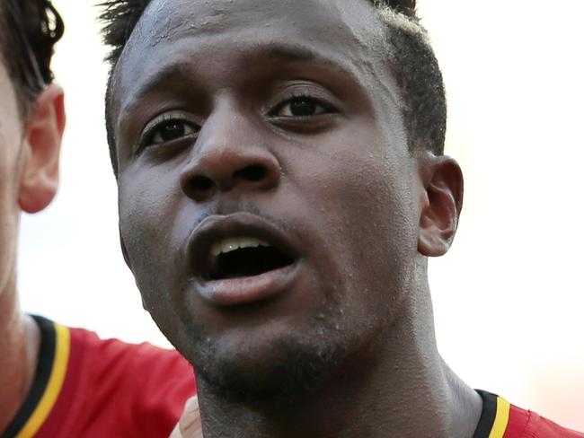 FILE - In this Sunday, June 22, 2014 file photo, Belgium's Divock Origi, center, celebrates with teammates Daniel Van Buyten, left, and Belgium's Axel Witsel, right, after Origi scored the opening goal during the group H World Cup soccer match between Belgium and Russia at the Maracana stadium in Rio de Janeiro, Brazil. Liverpool says it has signed Belgium striker Divock Origi from Lille and will loan him back to the French club for the whole of next season. The 19-year-old forward, who impressed during Belgium’s run to the quarterfinals of the World Cup, completed his transfer in the United States - where Liverpool is on a pre-season tour. The club said he had signed a “long-term deal” without giving details. British media put the transfer fee at 10 million pounds ($17 million). Origi, who joined Lille from Genk in 2010, says “Liverpool is one of the greatest clubs in the world and I’m very excited to be part of this great history.” (AP Photo/Ivan Sekretarev, file)