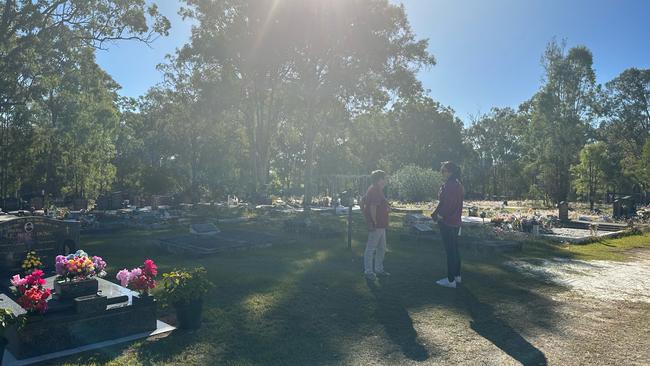 Ali Clarke and her mum Mary Cale at the Brisbane cemetery where Ali confirmed her long-lost father was buried in an unmarked grave. Picture: Supplied