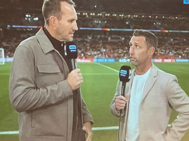 Optus Sport has received backlash due to presenters Mark Schwarzer (left) and Scott McDonald (right) covering Saturday's match from the sidelines. Picture: Twitter / @DanielleWarby