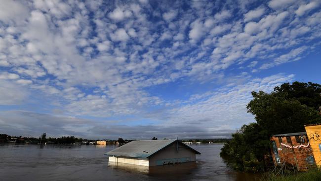 A submerged shed on the bank of the overflowing Clarence River at Grafton, on March 1, 2022. Picture: Saeed Khan/AFP