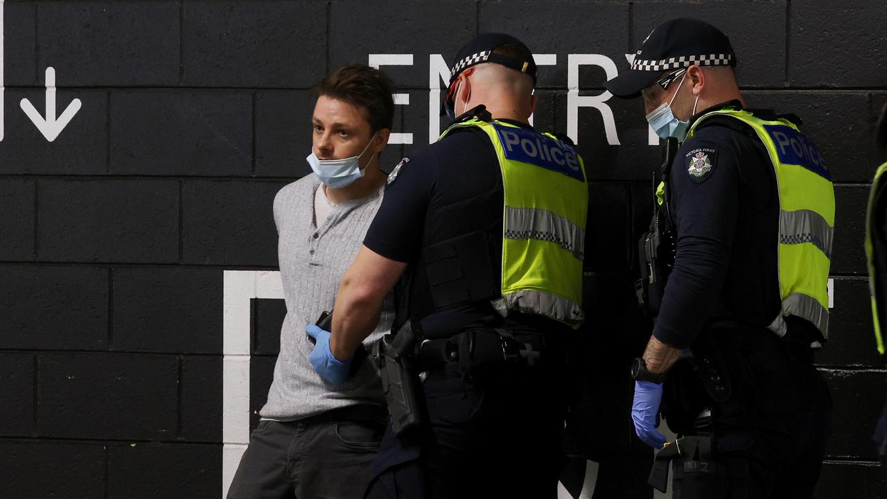 Police arrest an anti-lockdown protester at Eastland Shopping Centre in Ringwood. Picture: Paul Jeffers